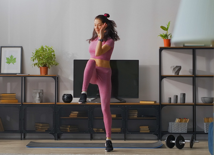 Personal trainer checking progress on a tablet